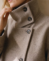 Close-up of the Ottilie Funnel Jacket collar tab with tortoiseshell-effect buttons