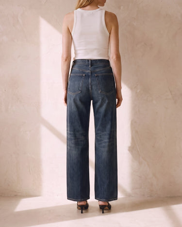 Back view of the Delphine Wide Leg Jeans with faded seat and knees, V back yoke and patch back pockets