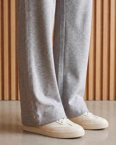 The Rae relaxed pant in light gray — close-up of the wide-leg hem