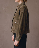 Side profile of the Juniper Suede Utility Jacket showing the boxy cropped fit