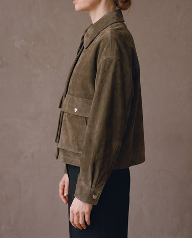 Side profile of the Juniper Suede Utility Jacket showing the boxy cropped fit