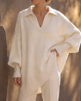 The Lorna Collared Knit in ivory — three-quarter view on model, hand on hip