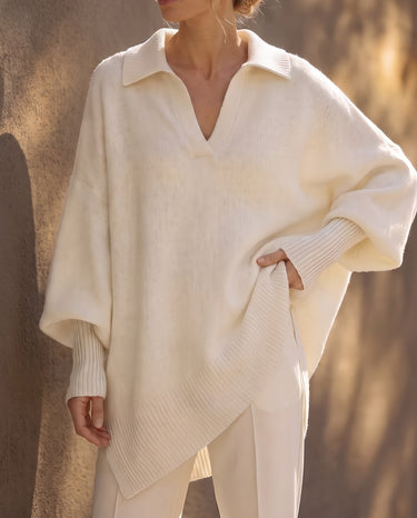 The Lorna Collared Knit in ivory — three-quarter view on model, hand on hip