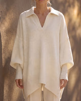The Lorna Collared Knit in ivory — front view on model showing batwing sleeves and pointed hem