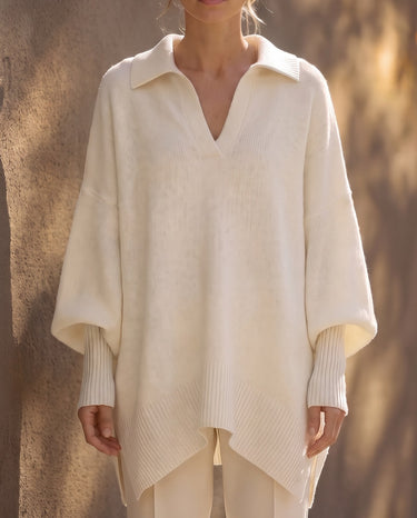 The Lorna Collared Knit in ivory — front view on model showing batwing sleeves and pointed hem