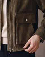 Close-up of the Juniper Suede Utility Jacket oversized flap pocket with snap