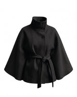 The Lorenne cape coat in black — belted wool cape with stand collar, product flat lay