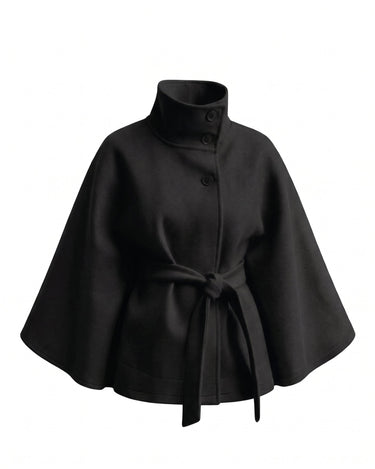 The Lorenne cape coat in black — belted wool cape with stand collar, product flat lay