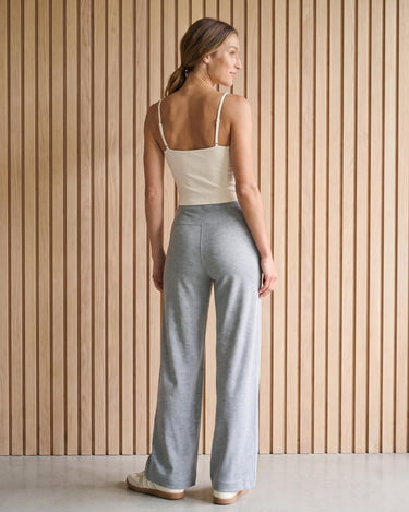 The Rae relaxed pant in light gray — back view on model
