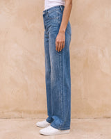 Sloane Straight Leg Jeans in blue — side view on model