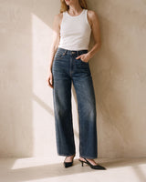 Delphine Wide Leg Jeans in dark vintage wash worn with a white ribbed tank and black slingbacks