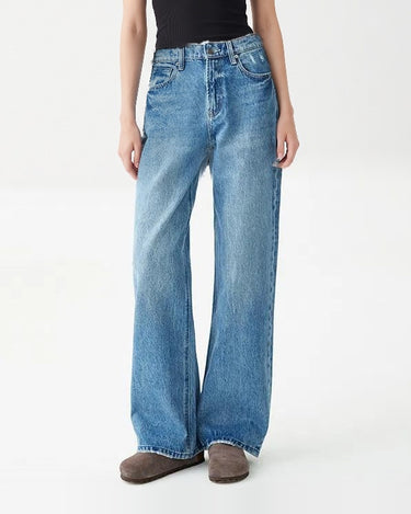 Full-length front view of Hallie Jeans in vintage blue wash with black tank