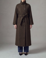 Henrietta Coat in brown, front view showing the lower-calf length and tie belt