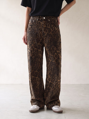Leopard print wide-leg jeans, front view with hand on hip