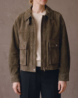Front view of the Juniper Suede Utility Jacket in olive worn open