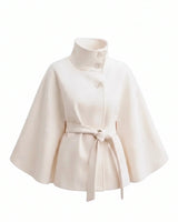 The Lorenne cape coat in white — belted wool cape with stand collar, product flat lay