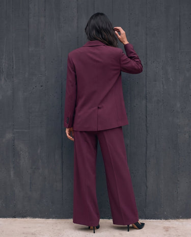 The Aliya Burgundy Blazer Set in burgundy — full suit, back view on model