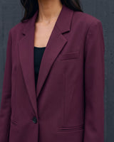 The Aliya Burgundy Blazer Set in burgundy — close-up of the blazer lapel and single-button front