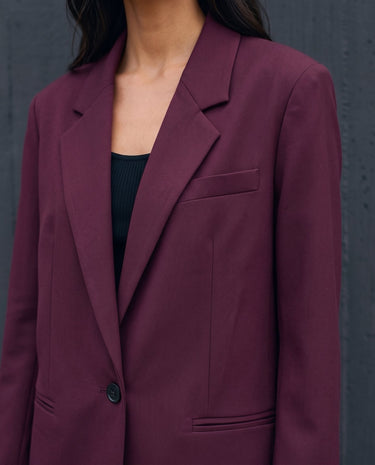 The Aliya Burgundy Blazer Set in burgundy — close-up of the blazer lapel and single-button front