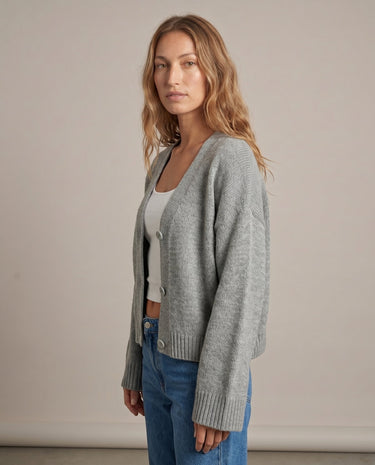 Gray knit cardigan on model, side view – Moriel Heritage