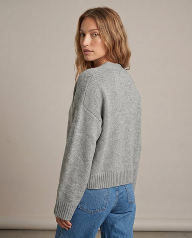 Gray knit cardigan on model, over-shoulder view – Moriel Heritage