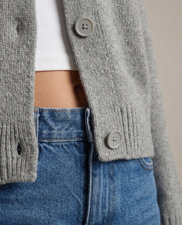Gray knit cardigan, hem and button close-up – Moriel Heritage
