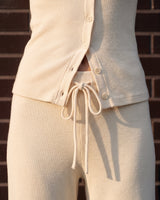 Amarie Set in cream — close-up of the button front and drawstring tie waist