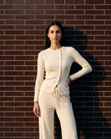 Amarie Set in cream — three-quarter front view on model showing the fitted cardigan