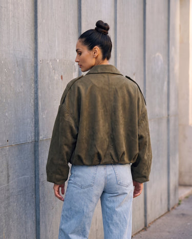 Back view of the olive green Astor Faux Suede Bomber Jacket showing the elasticated hem