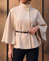 The Aurelia Shawl in beige — front view on model