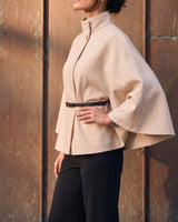 The Aurelia Shawl in beige — side view on model
