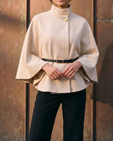 The Aurelia Shawl in beige — front view on model