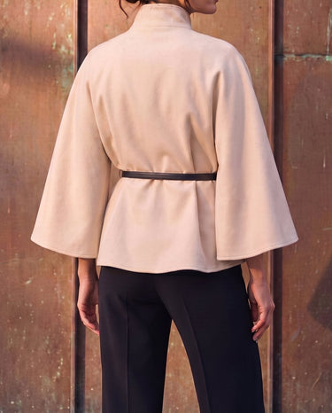 The Aurelia Shawl in beige — back view on model
