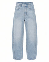 Barrel Jeans in light blue — mid-rise cotton-blend denim with a curved barrel leg tapering to the ankle, flat lay