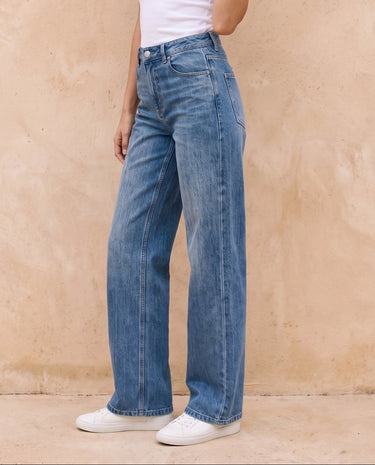 Sloane Straight Leg Jeans in blue — side view on model