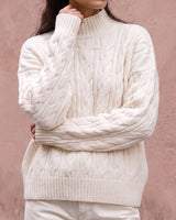 Boat Neck Cable Knit Sweater in white — front view on model