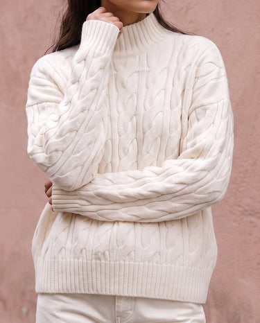 Boat Neck Cable Knit Sweater in white — front view on model