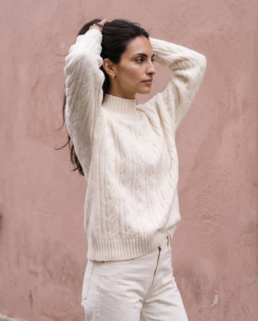 Boat Neck Cable Knit Sweater in white — front three-quarter view on model