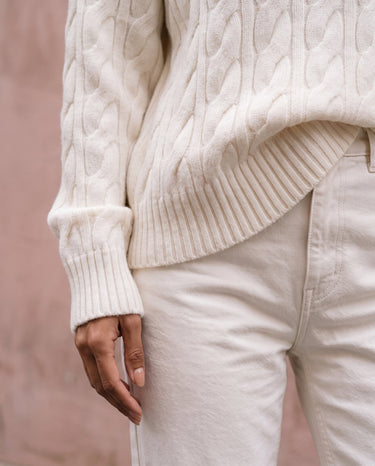 Boat Neck Cable Knit Sweater in white — close-up of the ribbed cuff