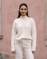 Boat Neck Cable Knit Sweater in white — front view on model