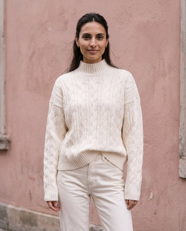 Boat Neck Cable Knit Sweater in white — front view on model