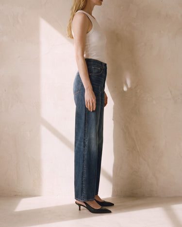 Side profile of the Delphine Wide Leg Jeans showing the high waist and straight wide leg