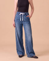 Isla Stretch Denim Jeans in Medium Blue - wide leg pull-on stretch denim on model