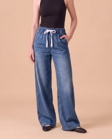 Isla Stretch Denim Jeans in Medium Blue - wide leg pull-on stretch denim on model