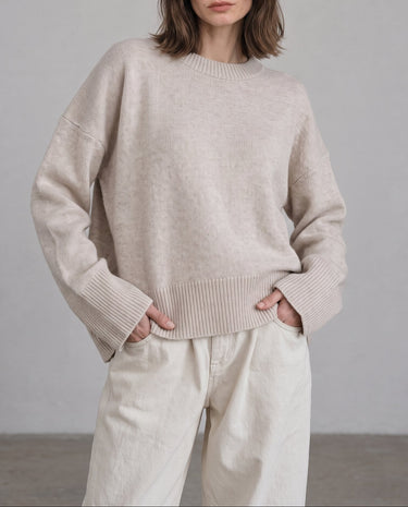 Beige Cali Knit on model — relaxed crew-neck sweater with white trousers, front view – Moriel Heritage