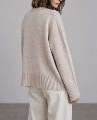 Beige Cali Knit, drop-shoulder seam close-up on model – Moriel Heritage
