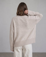 Beige Cali Knit on model, back view with arm raised – Moriel Heritage