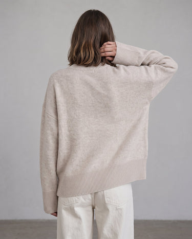 Beige Cali Knit on model, back view with arm raised – Moriel Heritage