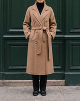 The Calvera double-breasted wool coat in khaki — full-length front view with hands in pockets on model