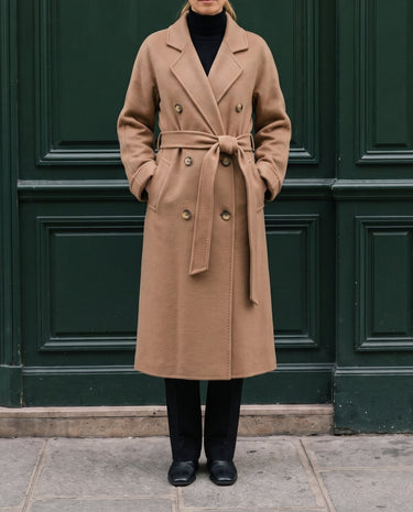 The Calvera double-breasted wool coat in khaki — full-length front view with hands in pockets on model